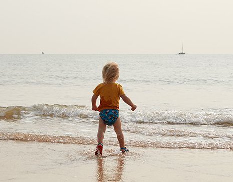 Max walking into the sea