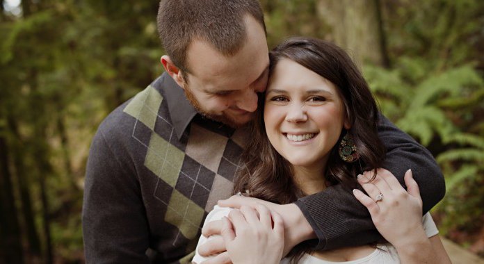 Couple cuddling and smiling