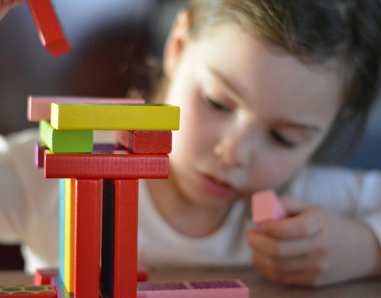 Girl playing with building blocks